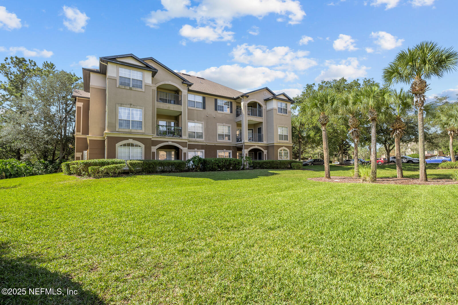 10961 Burnt Mill Road, Unit 1217 Jacksonville, FL 32256 - Photo 27 of 59 a front view of a house with a yard