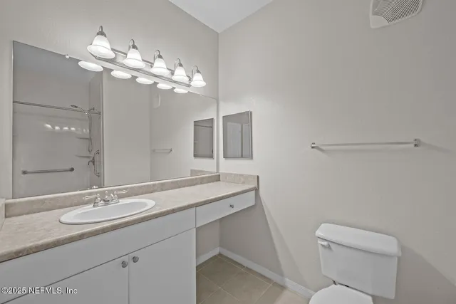 a front view of a house with garden and porch