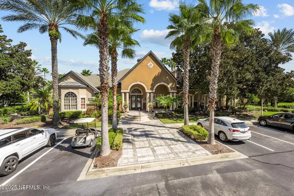 a living room with fireplace furniture and a large window
