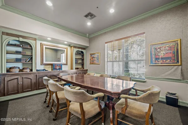 a view of a dining room with furniture