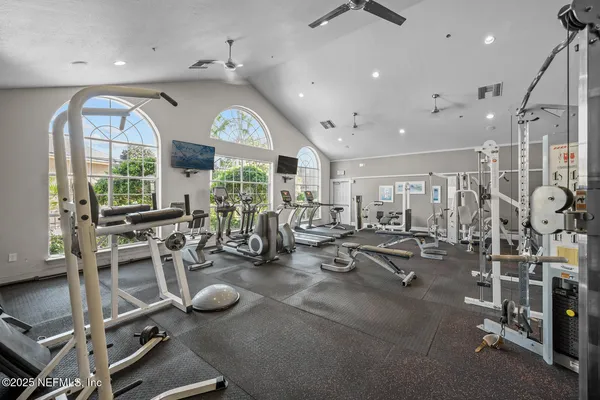 a view of swimming pool with outdoor seating and plants