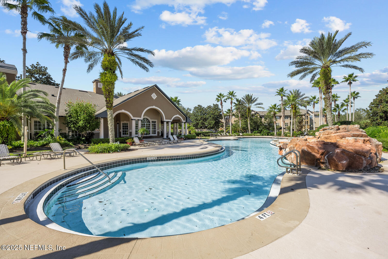 10961 Burnt Mill Road, Unit 1217 Jacksonville, FL 32256 - Photo 54 of 59 a view of a house with a swimming pool