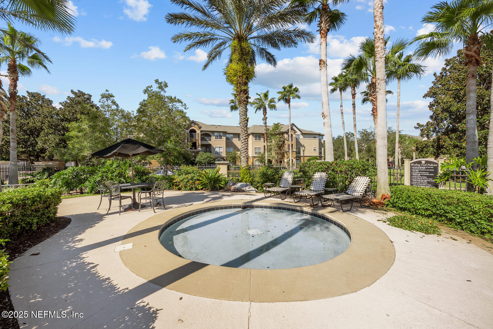 10961 Burnt Mill Road, Unit 1217 Jacksonville, FL 32256 - Photo 56 of 59 a view of a swimming pool with a garden