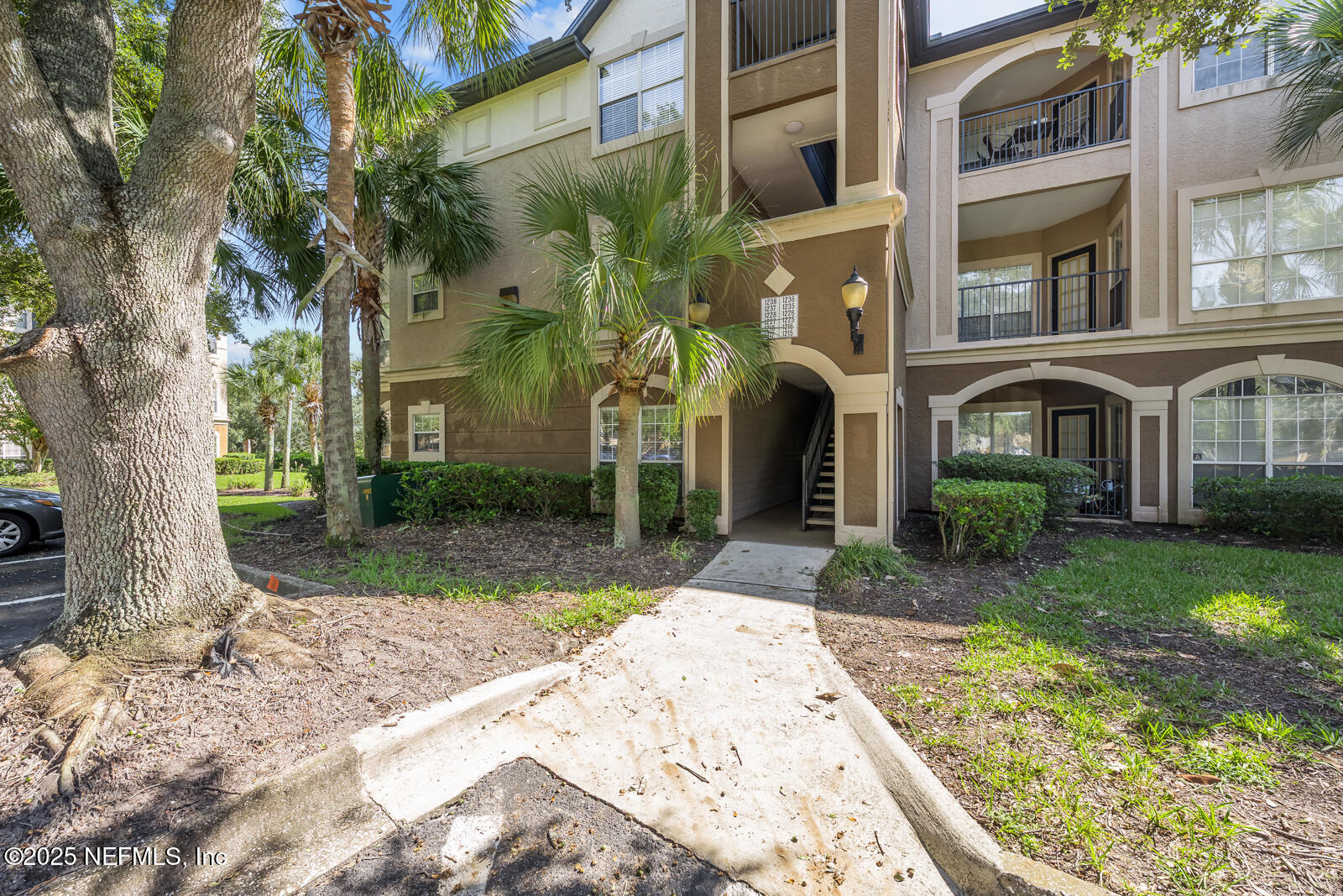 10961 Burnt Mill Road, Unit 1217 Jacksonville, FL 32256 - Photo 57 of 59 front view of a house with a yard