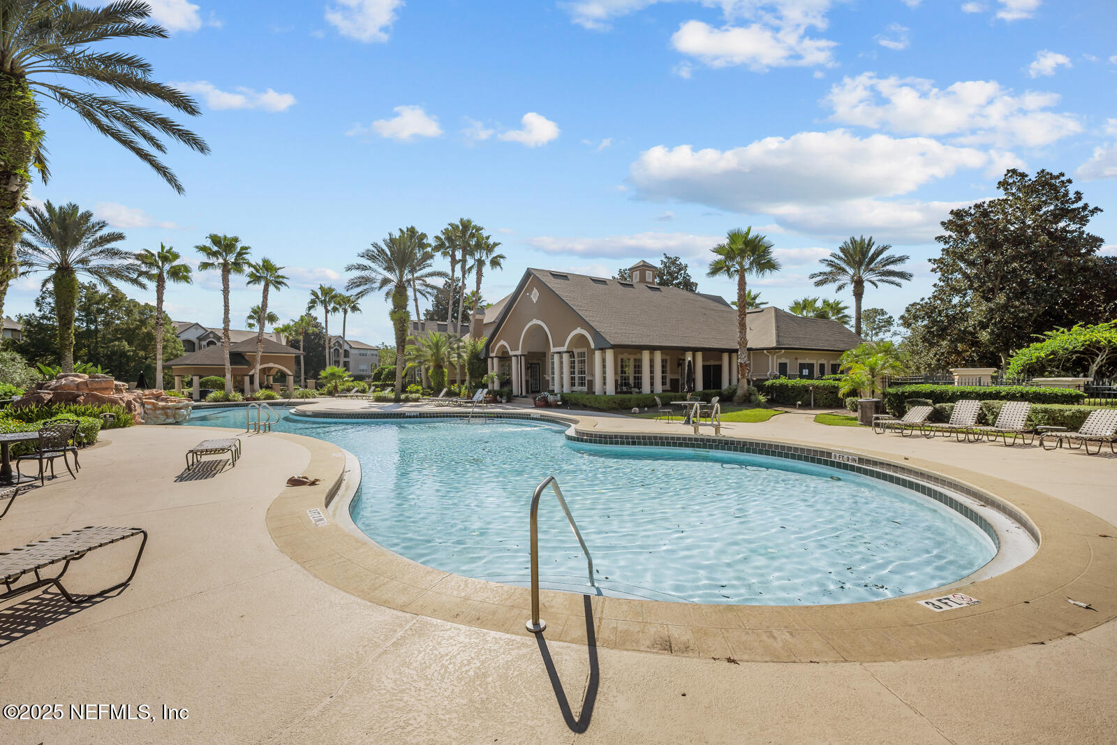 10961 Burnt Mill Road, Unit 1217 Jacksonville, FL 32256 - Photo 58 of 59 a swimming pool with outdoor seating and yard