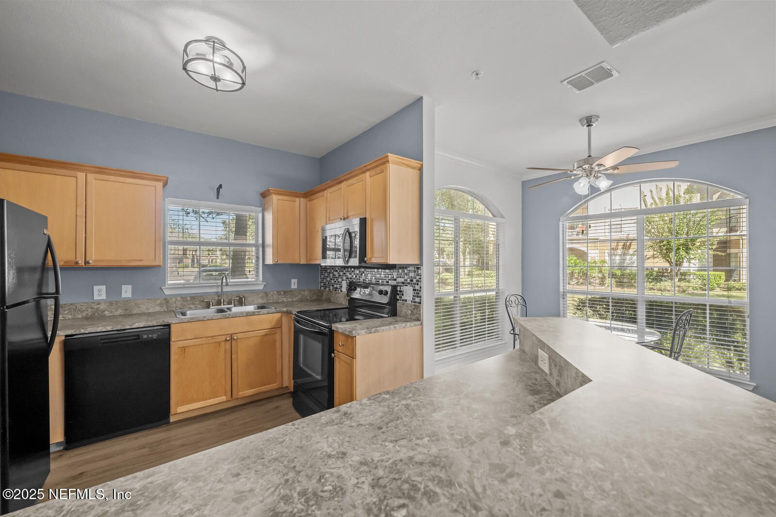 10961 Burnt Mill Road, Unit 1217 Jacksonville, FL 32256 - Photo 6 of 59 a kitchen with stainless steel appliances granite countertop a stove and a sink