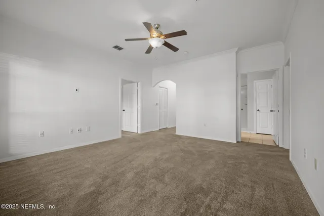 a kitchen with stainless steel appliances granite countertop a sink a stove and a wooden floors