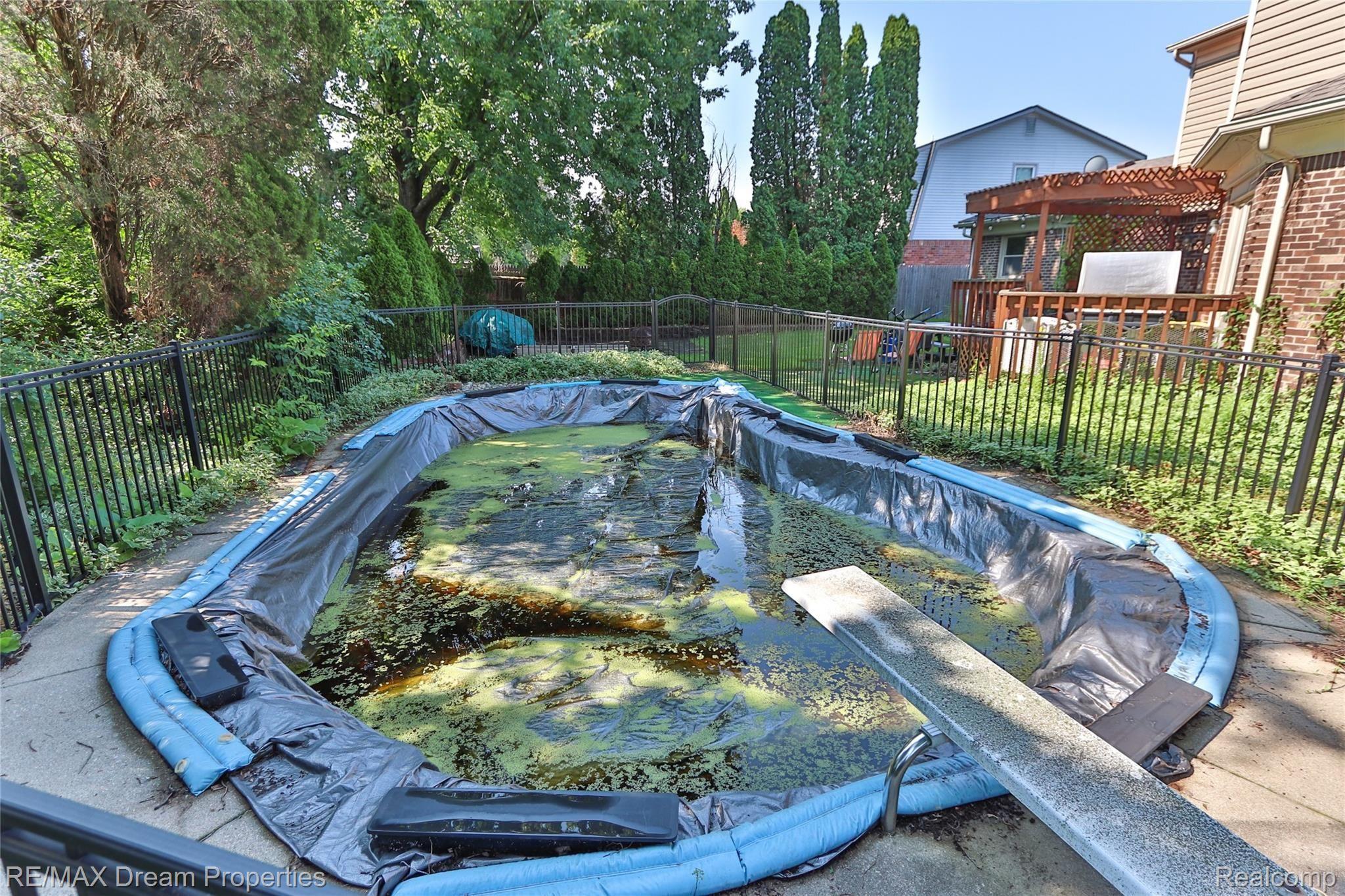3110 Burlington Drive Rochester, MI 48306 - Photo 34 of 34 POOL AREA NEWER FENCING -POOL LINER NEEDS REPLACING
