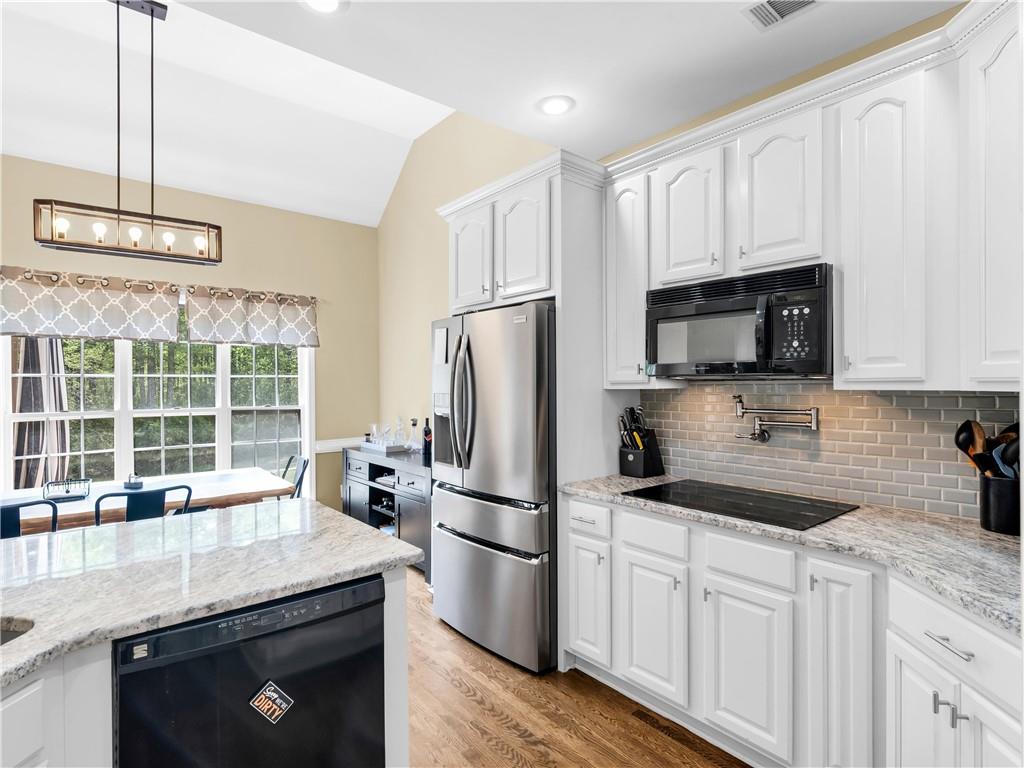 157 Cooks Way McDonough, GA 30252 - Photo 18 of 63 a kitchen with a refrigerator stove and microwave