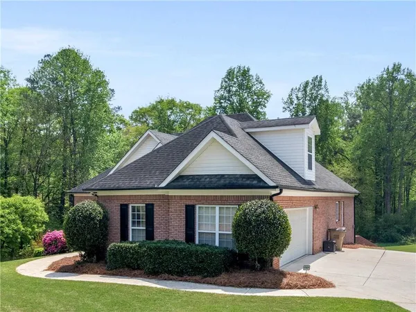 a front view of a house with garden