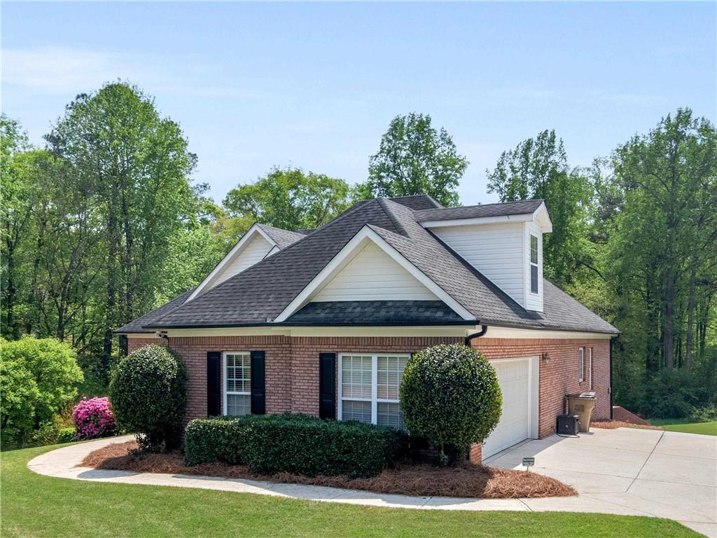 157 Cooks Way McDonough, GA 30252 - Photo 2 of 63 a front view of a house with garden