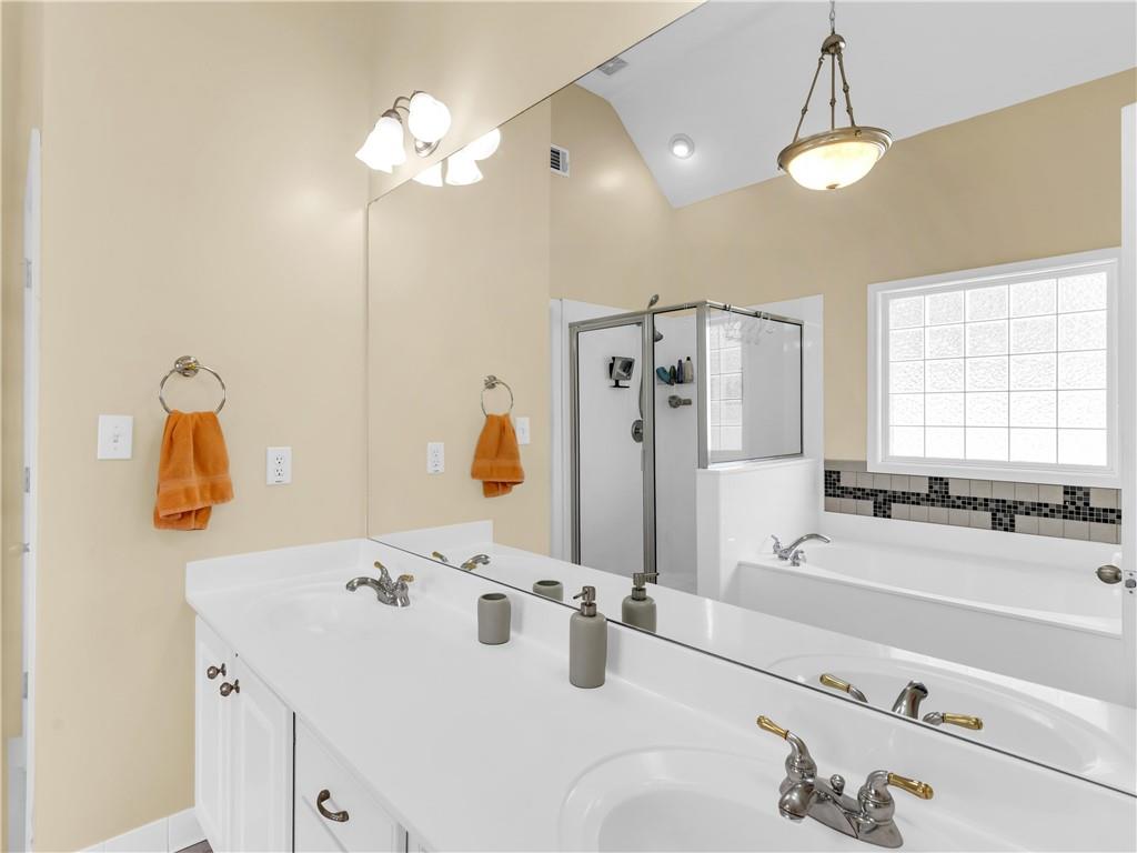 157 Cooks Way McDonough, GA 30252 - Photo 25 of 63 a bathroom with a tub sink and mirror