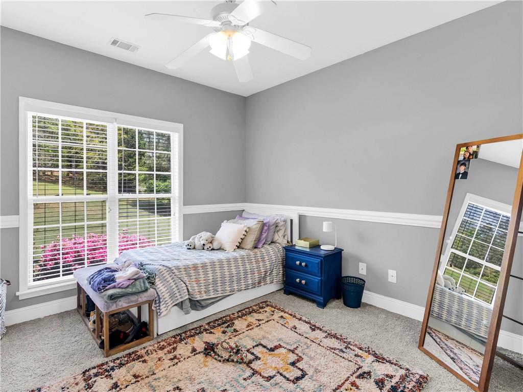 157 Cooks Way McDonough, GA 30252 - Photo 28 of 63 a bedroom with furniture and a window