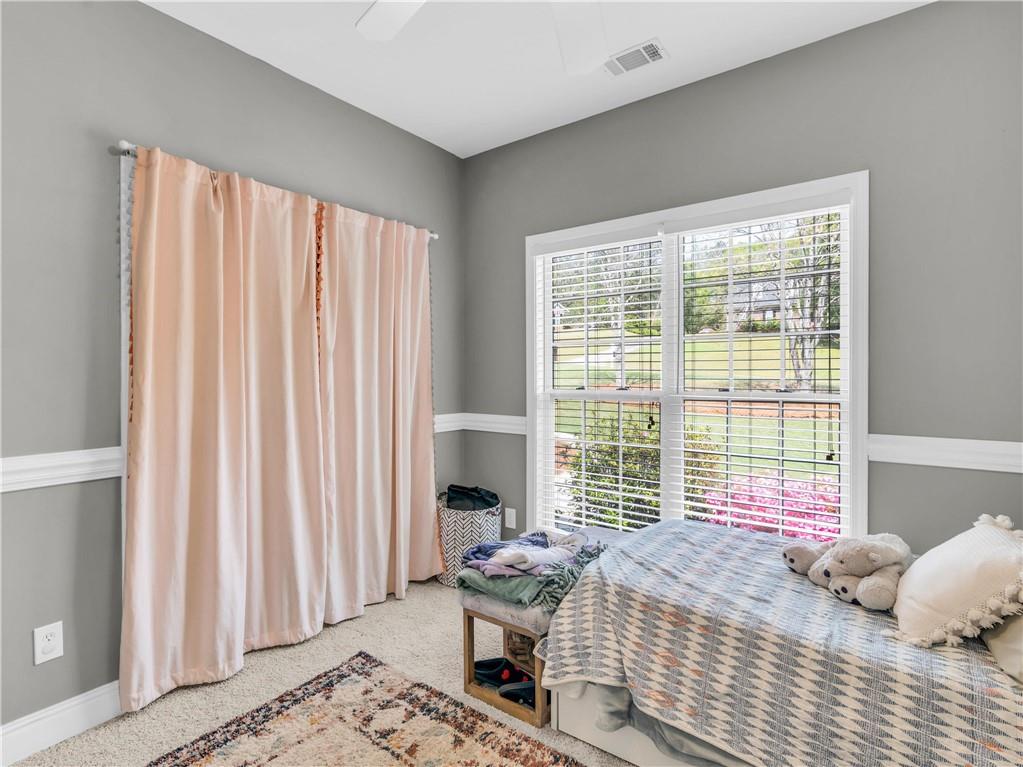157 Cooks Way McDonough, GA 30252 - Photo 29 of 63 a bedroom with a bed and a window