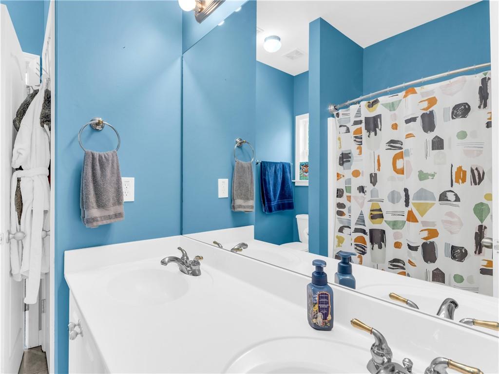 157 Cooks Way McDonough, GA 30252 - Photo 32 of 63 a bathroom with a sink and a mirror