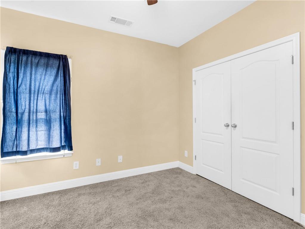 157 Cooks Way McDonough, GA 30252 - Photo 38 of 63 a view of an empty room with wooden floor and a window