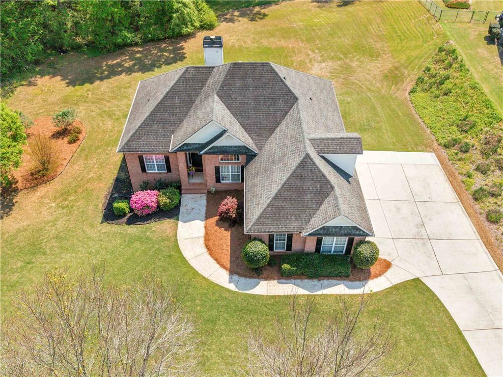 157 Cooks Way McDonough, GA 30252 - Photo 4 of 63 a aerial view of a house with swimming pool and large trees