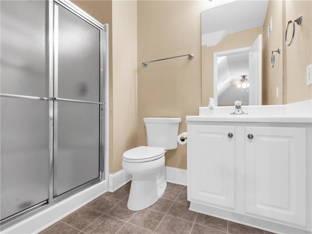 157 Cooks Way McDonough, GA 30252 - Photo 41 of 63 a bathroom with a sink a toilet and shower