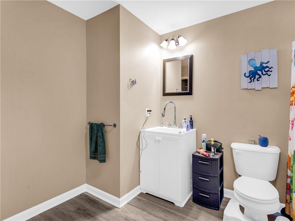 157 Cooks Way McDonough, GA 30252 - Photo 46 of 63 a bathroom with a toilet sink and mirror
