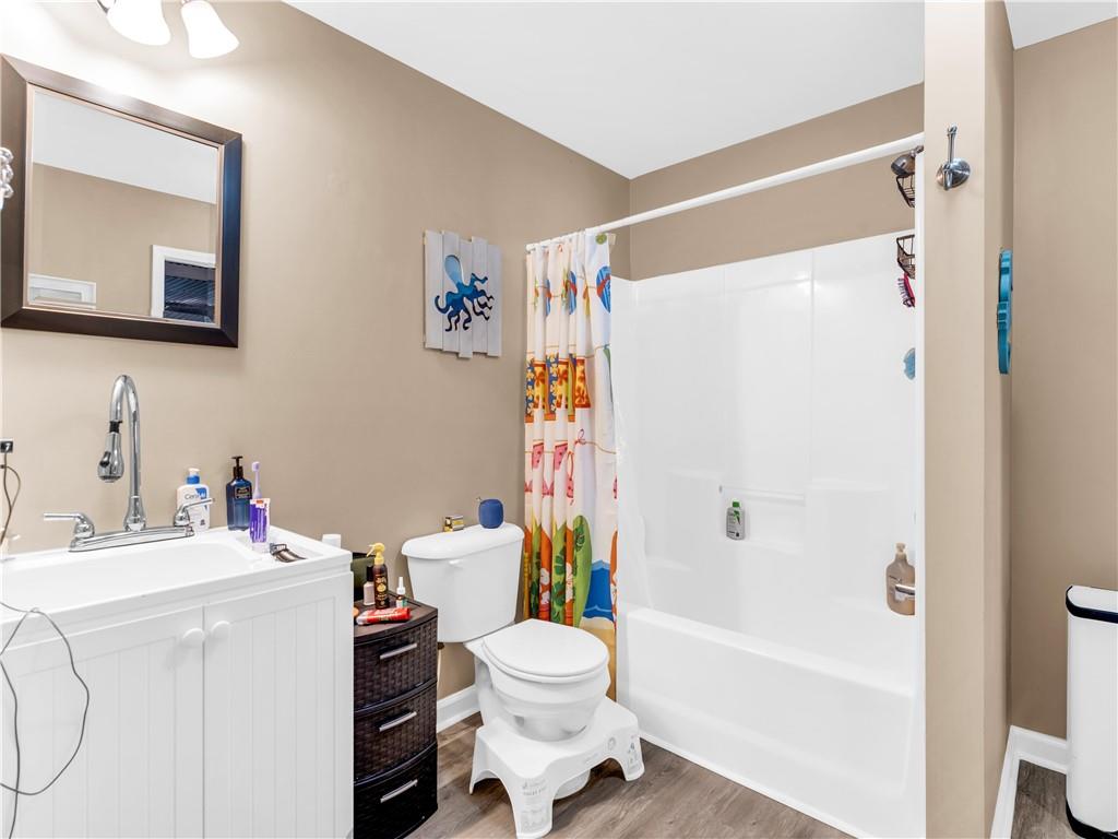 157 Cooks Way McDonough, GA 30252 - Photo 47 of 63 a white toilet sitting next to a bathroom sink and a bath tub