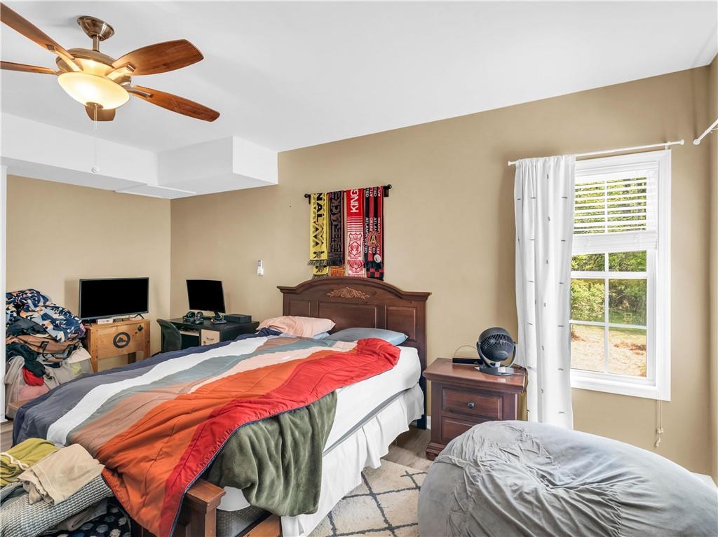157 Cooks Way McDonough, GA 30252 - Photo 49 of 63 a bedroom with a bed and a window