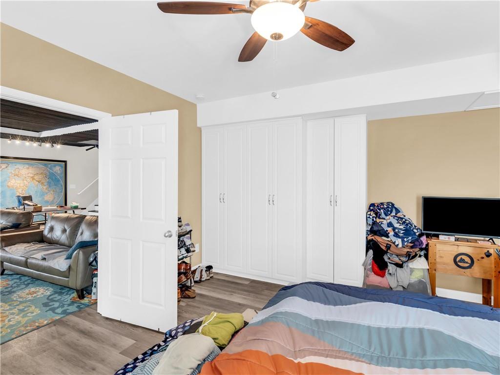 157 Cooks Way McDonough, GA 30252 - Photo 50 of 63 a bedroom with a bed and a chandelier