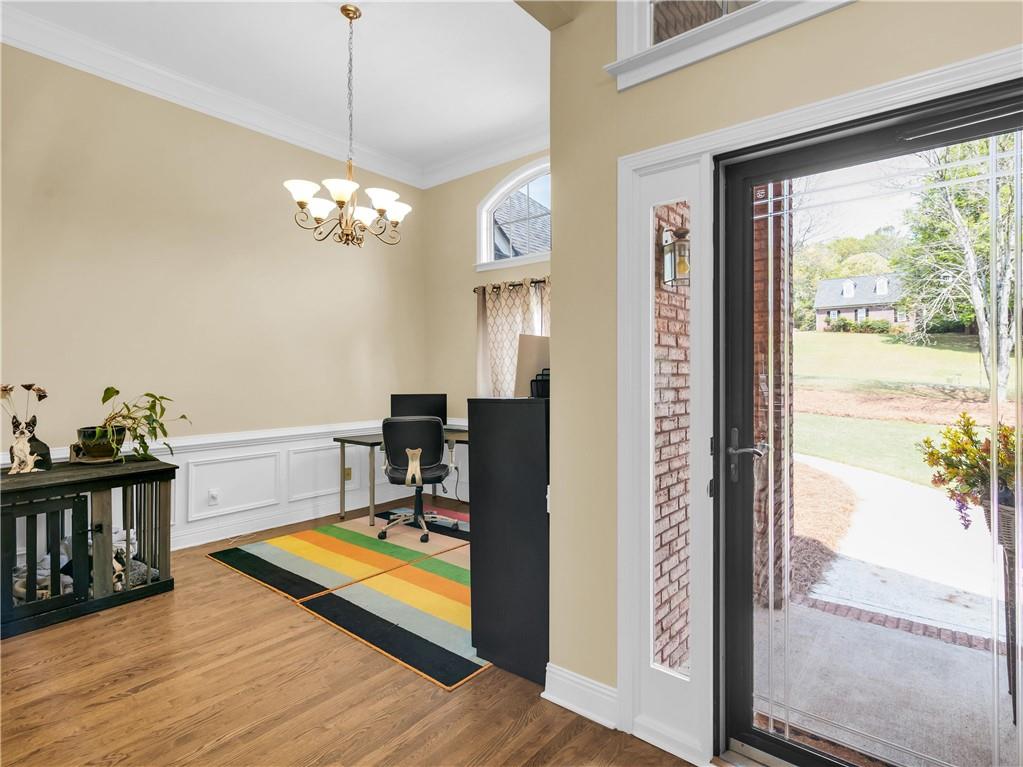 157 Cooks Way McDonough, GA 30252 - Photo 5 of 63 a view of a livingroom with furniture window and wooden floor