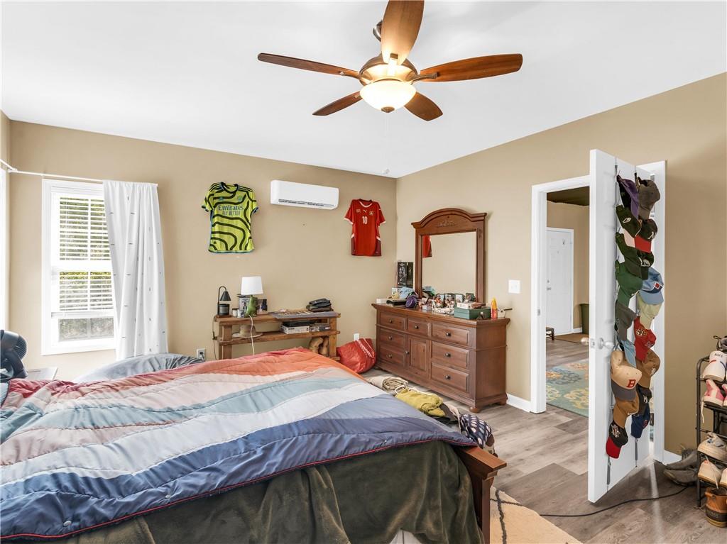 157 Cooks Way McDonough, GA 30252 - Photo 51 of 63 a bedroom with a bed dresser and a window