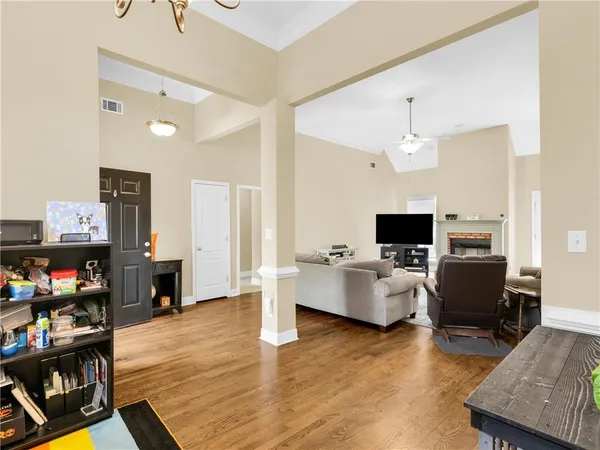 a living room with furniture and a flat screen tv