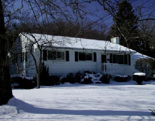 13 Lloyd Road Norwalk, CT 06850 - Photo 1 of 1 a front view of a house with a yard