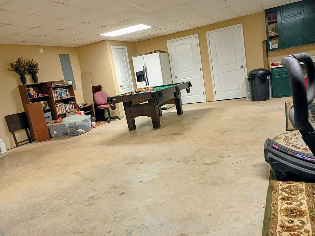 303 Wilson Road Chatsworth, GA 30705 - Photo 35 of 55 2nd garage in basement lots of room, with two large storage rooms.14.10' x 9.4'