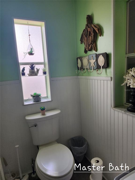 1001 Starkey Road, Unit 758 Largo, FL 33771 - Photo 14 of 20 a bathroom with a toilet and a sink