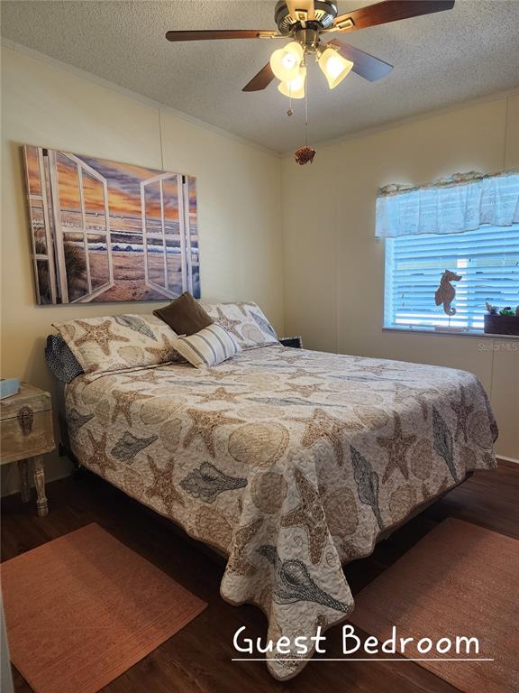1001 Starkey Road, Unit 758 Largo, FL 33771 - Photo 16 of 20 a bed sitting in a bedroom next to a window