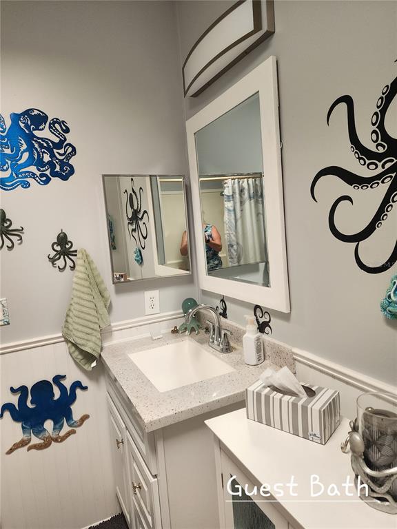 1001 Starkey Road, Unit 758 Largo, FL 33771 - Photo 17 of 20 a bathroom with a sink and a mirror