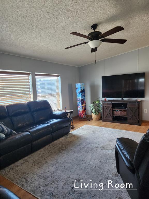 1001 Starkey Road, Unit 758 Largo, FL 33771 - Photo 3 of 20 a living room with furniture and a flat screen tv