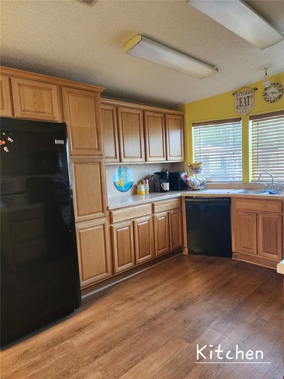 1001 Starkey Road, Unit 758 Largo, FL 33771 - Photo 7 of 20 a kitchen with a sink window and cabinets