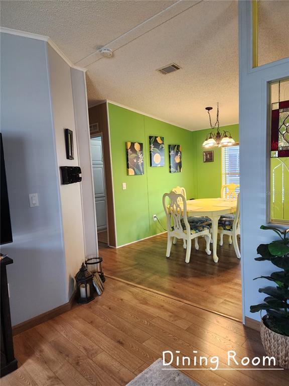 1001 Starkey Road, Unit 758 Largo, FL 33771 - Photo 9 of 20 a view of a dining room with furniture