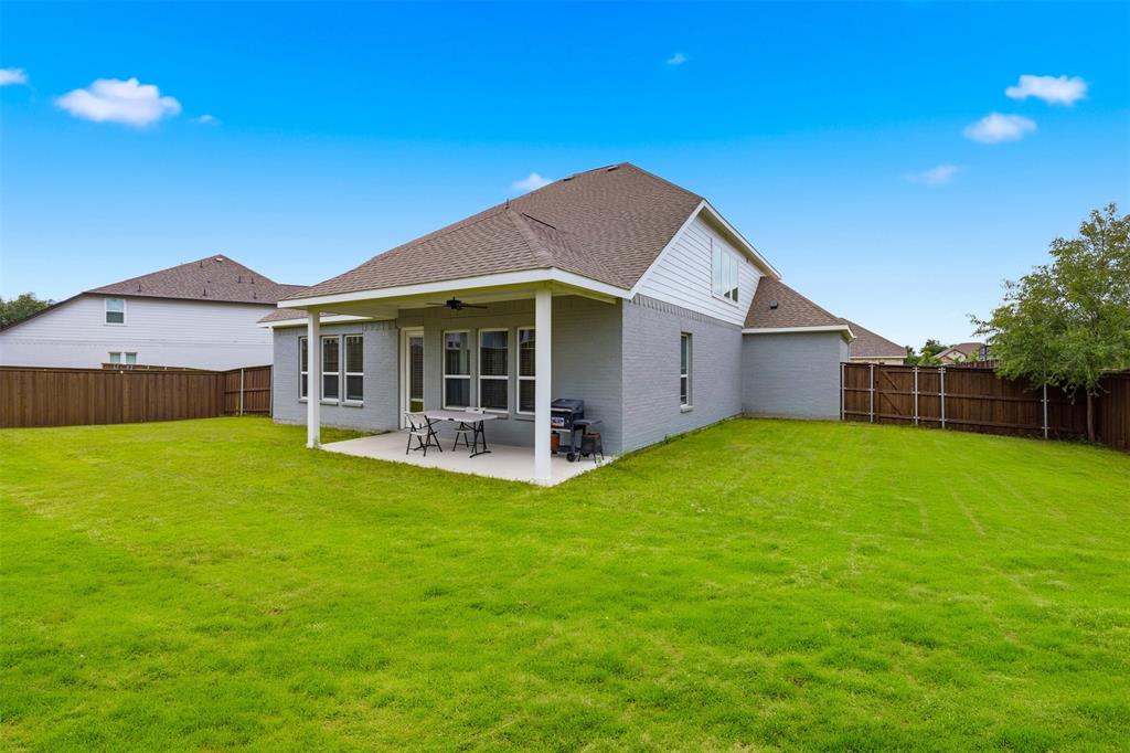 5805 Heatherwood Loop Sachse, TX 75048 - Photo 5 of 39 a view of a house with a backyard