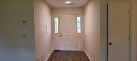 a view of a bathroom with a sink and a mirror