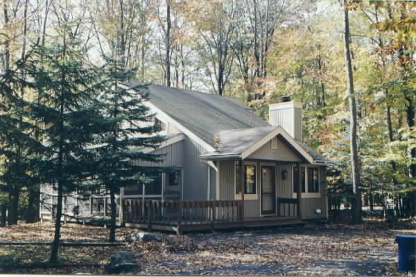 311 Deer Run Road Pocono Lake, PA 18347 - Photo 1 of 1 a front view of a house with a garden