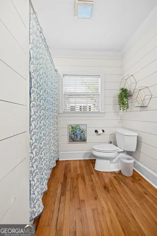 a bathroom with a bathtub and a toilet