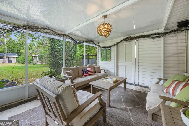 a view of a patio with a table chairs and a table
