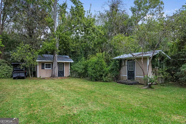 a front view of a house with a garden and porch