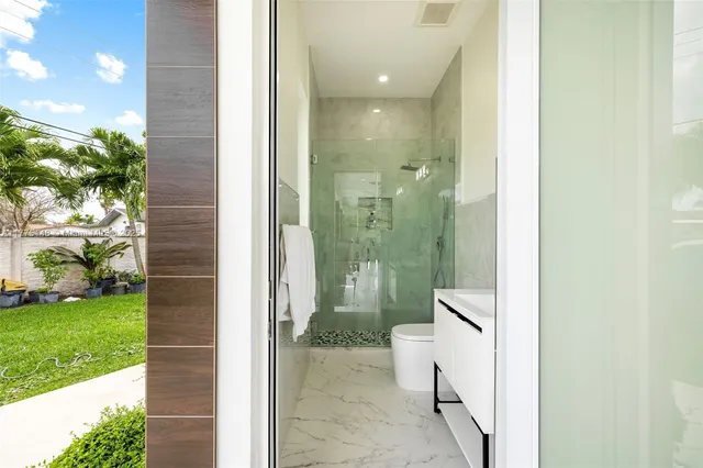 a bathroom with a shower and a sink