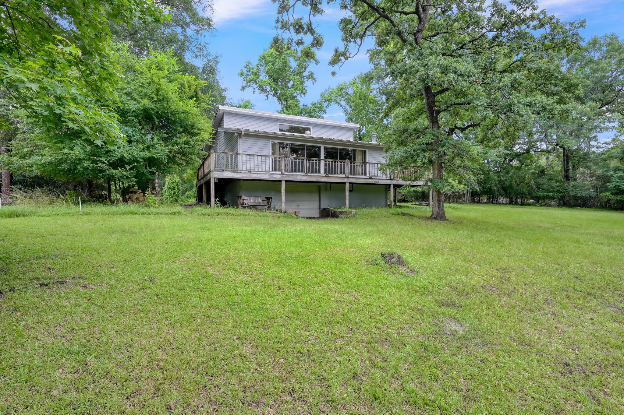 254 Sharp Lane Trinity, TX 75862 - Photo 30 of 36 a view of a house with a big yard and large trees
