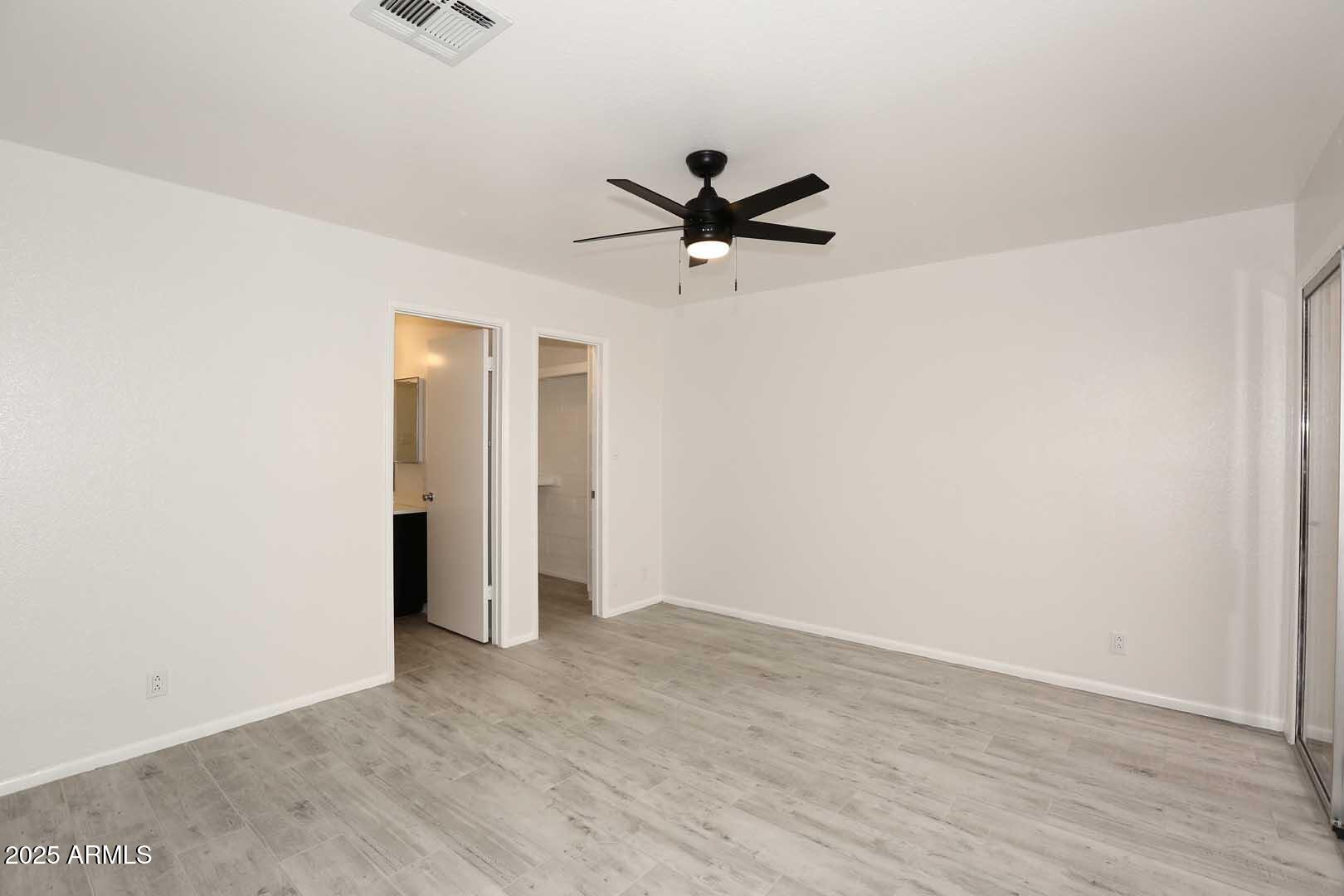 93 North Cooper Road, Unit 32 Chandler, AZ 85225 - Photo 12 of 33 wooden floor in an empty room