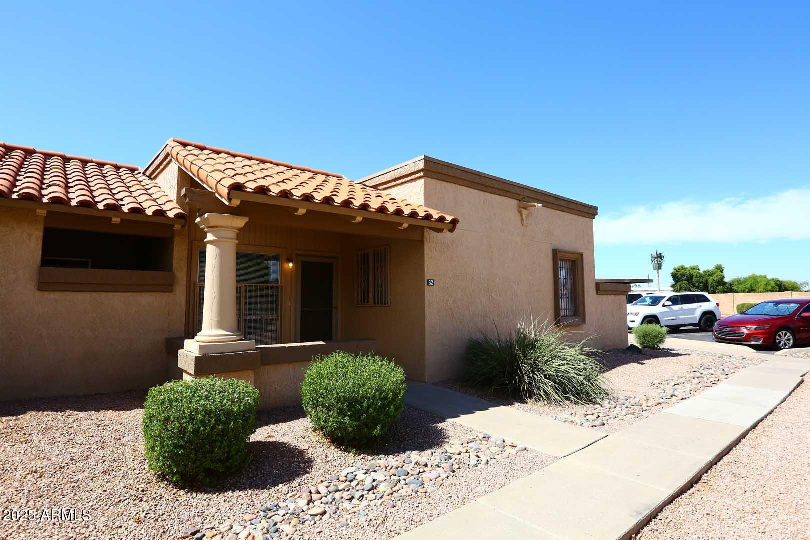 93 North Cooper Road, Unit 32 Chandler, AZ 85225 - Photo 22 of 33 a view of a house with a patio
