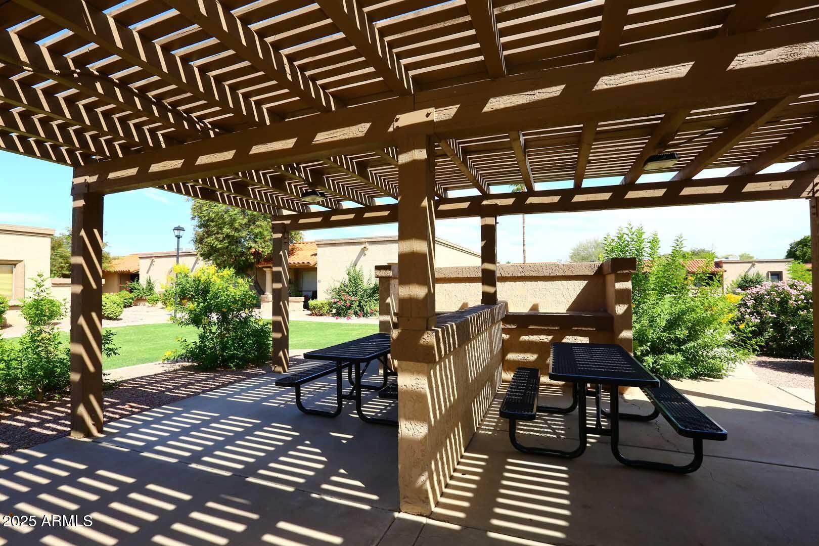 93 North Cooper Road, Unit 32 Chandler, AZ 85225 - Photo 29 of 33 a view of a chairs and table in the patio