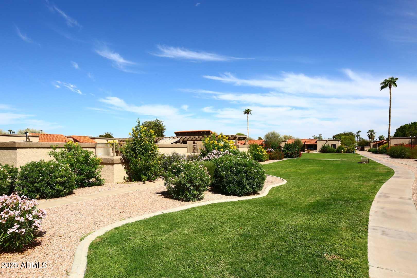 93 North Cooper Road, Unit 32 Chandler, AZ 85225 - Photo 30 of 33 a view of a garden with houses