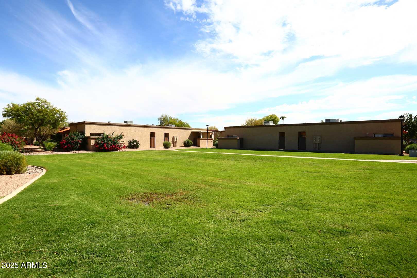 93 North Cooper Road, Unit 32 Chandler, AZ 85225 - Photo 32 of 33 a front view of a house with garden